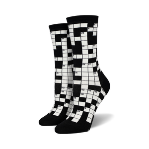 Pair of black and white crew socks featuring a crossword puzzle design.  The numbers are clearly visible against the contrasting background.
