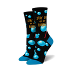 Pair of crew socks with a black background, light-blue bubbles, and the phrase 'Stay Out Of My Bubble'.