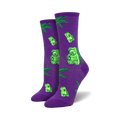 Pair of women's crew socks. Purple socks showcase green gummy bears and marijuana leaves. Black socks show the same design on a black background.
