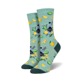 Lifestyle shot showing the teal 'Gin It To Win It' socks on a model's feet, highlighting their fit and pattern.