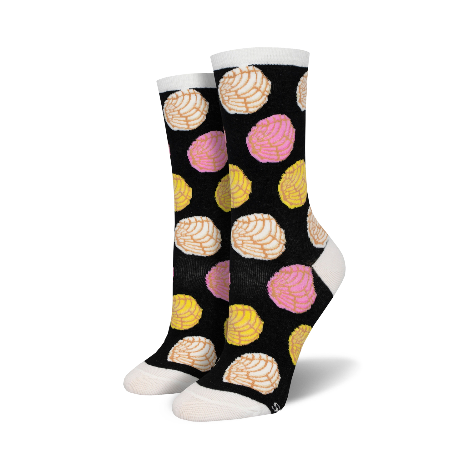 A pair of black crew socks with a fun pattern of colorful pan dulce (conchas) in pink, yellow, and white.