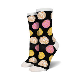 black crew socks with a vibrant pink, yellow, and white concha shell design.   