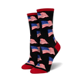 Pair of crew socks with a black background and repeating American flag pattern in red, white, and blue. Red and navy accents at the cuffs.