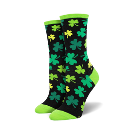 black crew socks for women with a green top and pattern of four-leaf clovers in green with yellow outlines. great for st. patrick's day.   