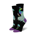 Pair of women's crew socks. Black background with teal, purple, and green peacock design and purple flowers. Purple and teal cuffs.