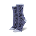 Don't Give A Hoot crew socks in periwinkle blue, featuring black owls on trees, white stars & moons. Light blue cuffs/toes.