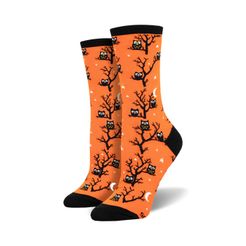 owl print crew socks in orange with black trees, crescent moons, and a starry night background to add a touch of whimsy to your everyday wardrobe.  