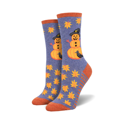 womens halloween-themed crew socks. blue with pattern of fall leaves and pumpkin with witch hat and crow.   