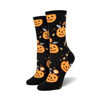 black crew socks with orange pumpkins and wrapped orange and white candies.  