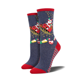 dark blue crew socks with a christmas pattern of santa claus, reindeer, candy canes, stars, christmas trees, and presents. red top with white stars, red toe and heel.   