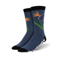 Pair of crew socks in navy blue featuring orange bird-of-paradise flowers and a black and white zebra-striped cuff.