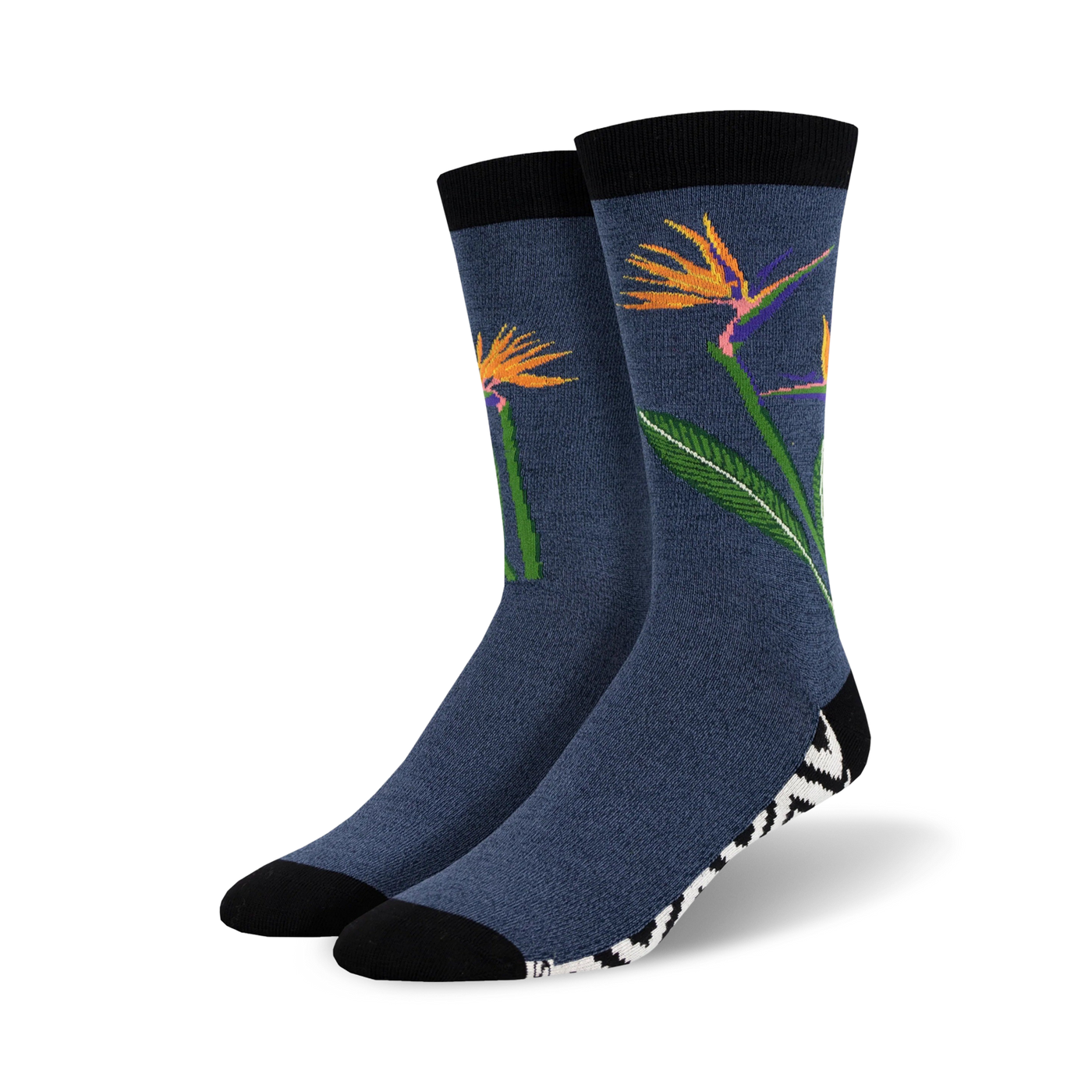 Pair of crew socks in navy blue featuring orange bird-of-paradise flowers and a black and white zebra-striped cuff.