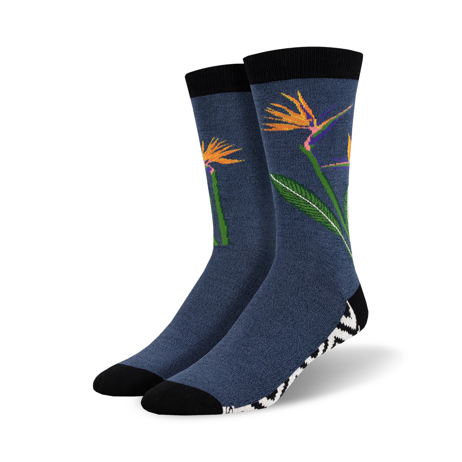 Pair of crew socks in navy blue featuring orange bird-of-paradise flowers and a black and white zebra-striped cuff.
