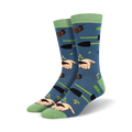 Pair of crew socks in blue with a gardening theme.  Features hands planting seeds, gardening tools, and snails on a soft blue background. Green accents on cuffs.
