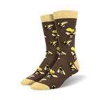 Pair of brown crew socks with a repeating pattern of yellow and black bumblebees and honeycombs.  The socks have a light yellow cuff.