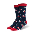 Pair of crew socks in navy blue with a repeating pattern of gray sharks and red and white life preservers. Red ribbed cuff.