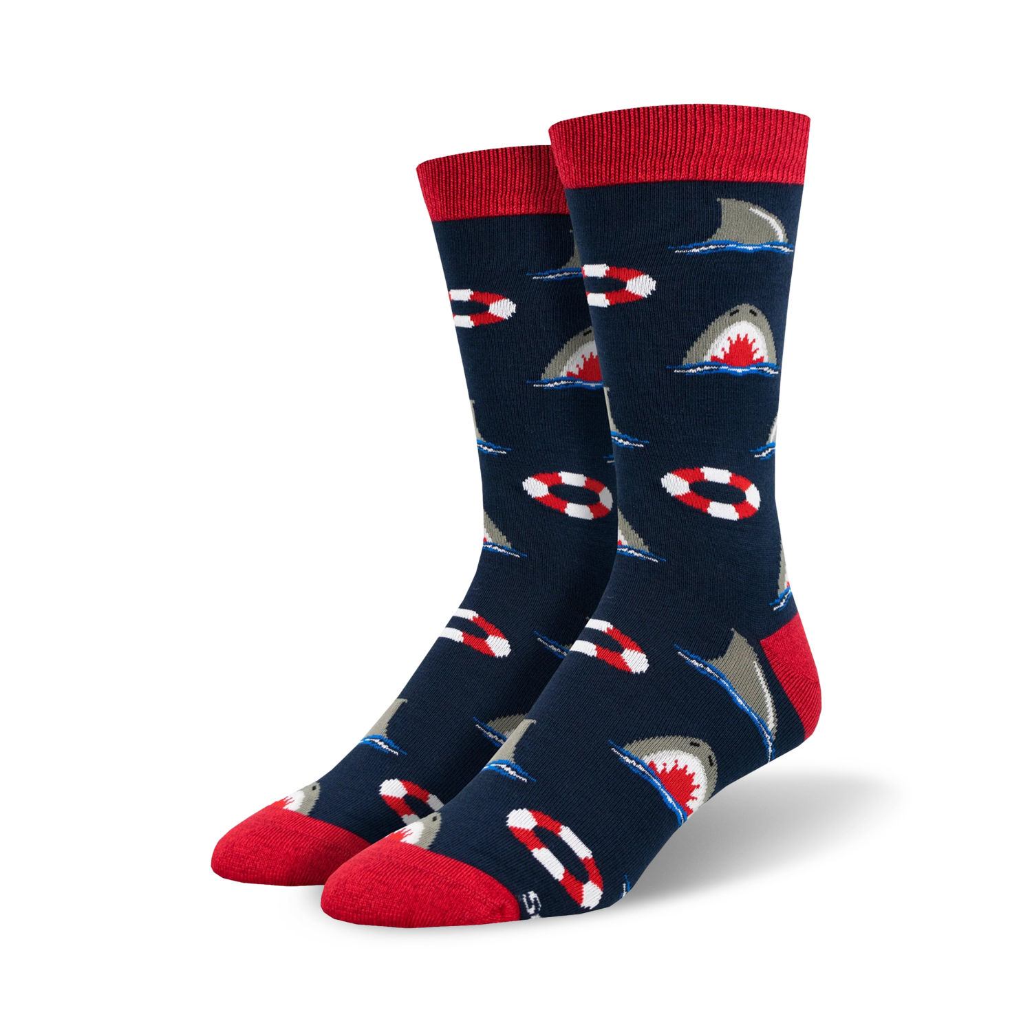 Pair of crew socks in navy blue with a repeating pattern of gray sharks and red and white life preservers. Red ribbed cuff.