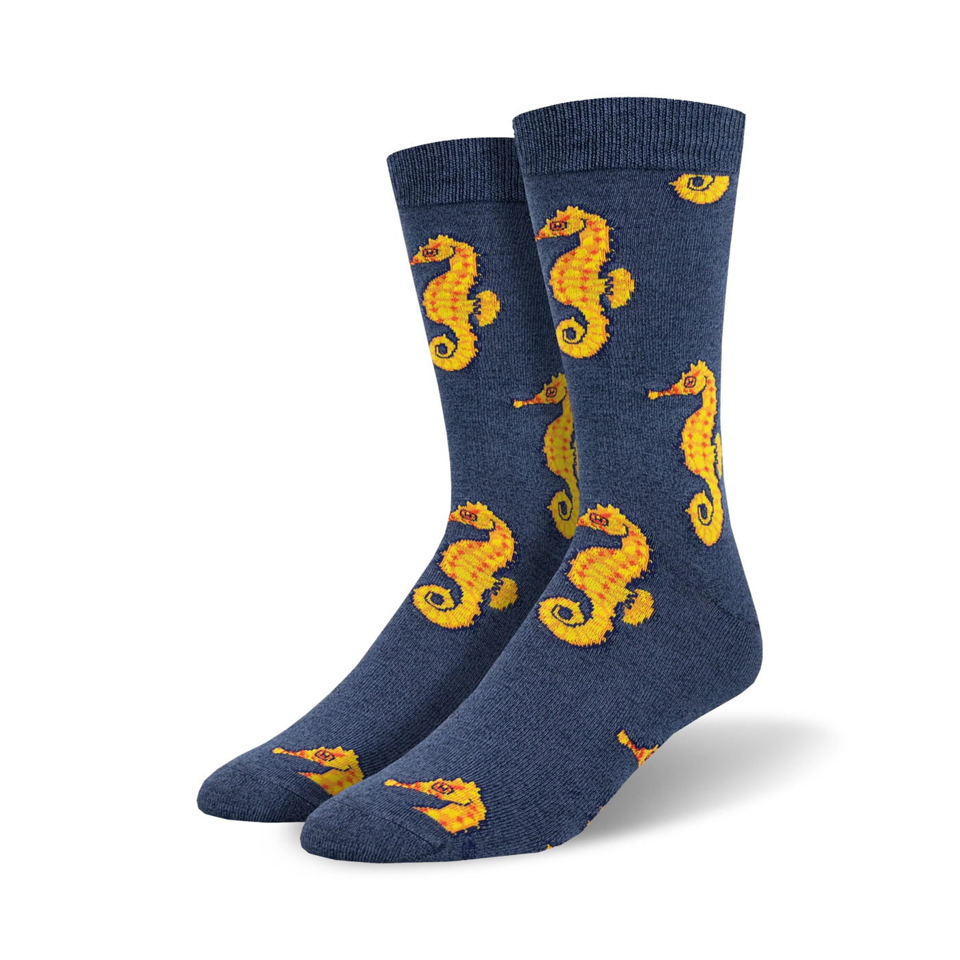 Pair of navy blue crew socks featuring a repeating pattern of yellow seahorses. Made from a bamboo blend.