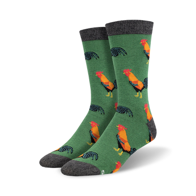 red, orange, yellow, and black cartoon roosters on a green background. crew length men's socks. <br> 