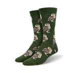 Pair of crew socks; olive green with repeating burrowing owl pattern. Owls are brown, white, and beige.