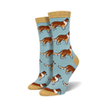 Pair of women's crew socks. Light blue background with repeating pattern of brown and white Collie dogs. Mustard yellow cuff.