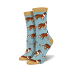 Pair of women's crew socks. Light blue background with repeating pattern of brown and white Collie dogs. Mustard yellow cuff.