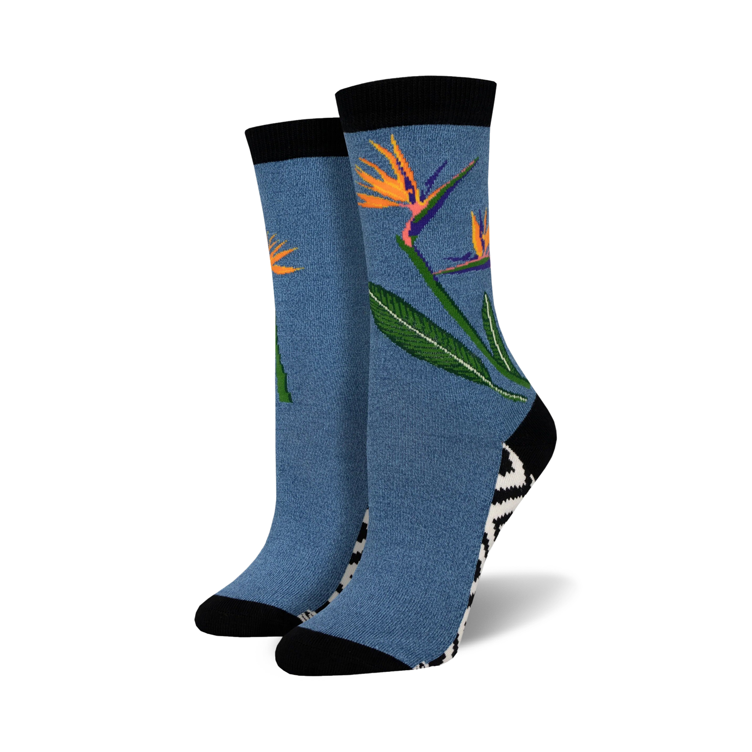 Pair of crew socks in blue featuring a bird-of-paradise flower design.  Black and white zig-zag pattern at the ankle. Soft bamboo.