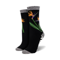 Close-up of a pair of black Birds of Paradise bamboo socks.  The socks feature a grey marl cuff and a black and white geometric pattern at the ankle.
