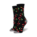 Pair of black crew socks with a fun pattern of red, green, and orange chili peppers.  The socks have a gray reinforced heel and toe.