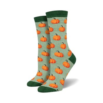 light sage green crew socks with cartoon pumpkin pattern, perfect for halloween.   