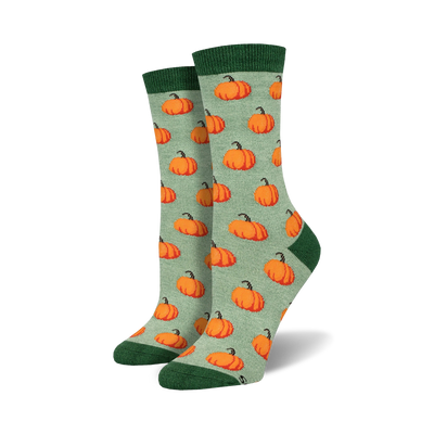 light sage green crew socks with cartoon pumpkin pattern, perfect for halloween.   