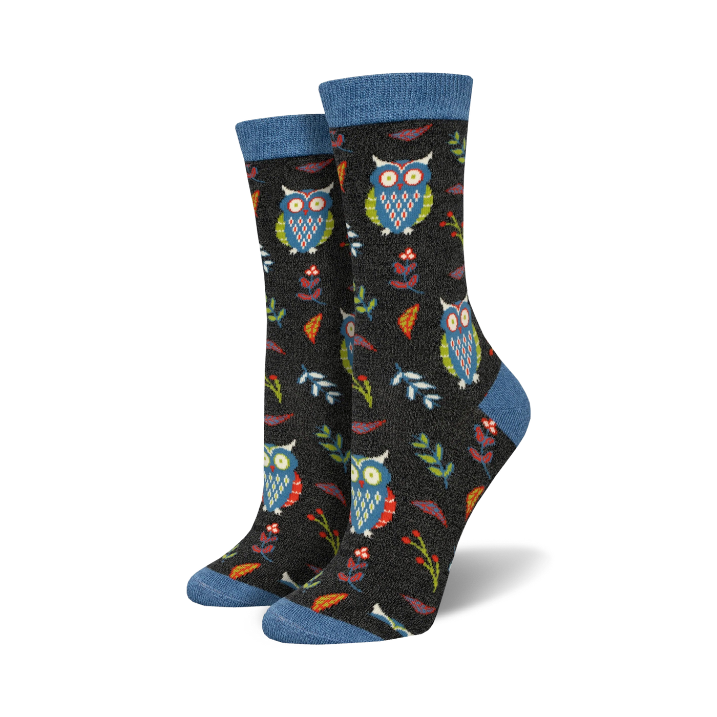 Close-up of a pair of black crew socks with owls, leaves, and berries. Blue top trim.