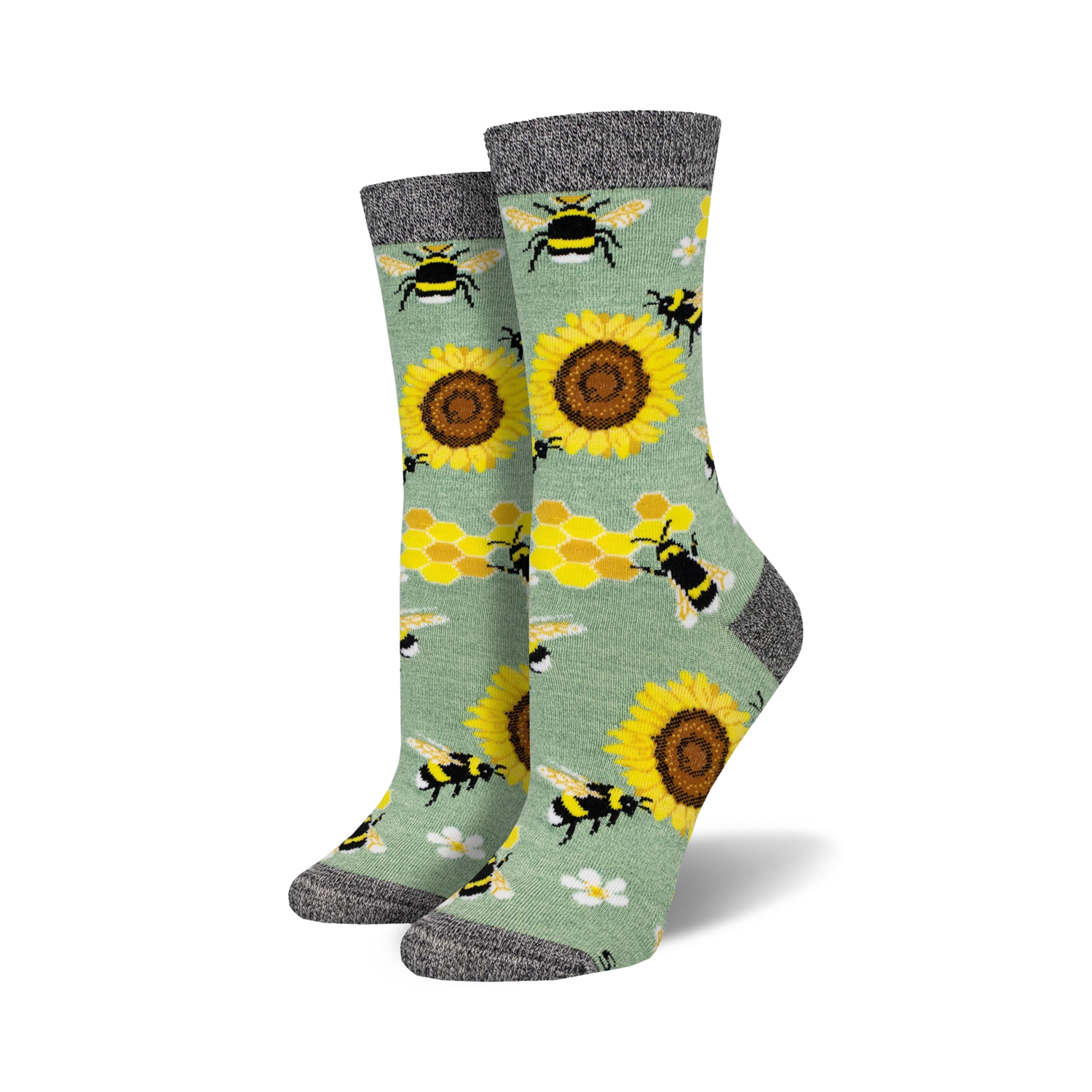 Pair of crew socks with bees, sunflowers, and honeycomb pattern on a sage green background.  Black and grey top cuff.