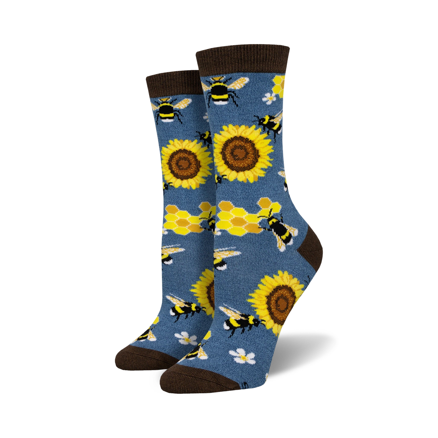 A pair of crew socks with bees, sunflowers and honeycomb pattern on a denim blue background. Brown top cuff.
