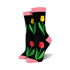 Pair of women's crew socks. Black background with red, yellow tulips and green leaves. Pink top trim.