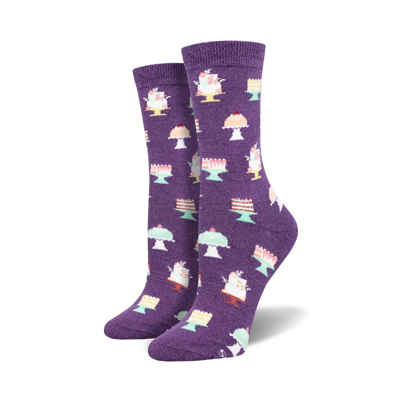 Pair of purple crew socks adorned with a repeating pattern of pastel-colored cakes on stands.