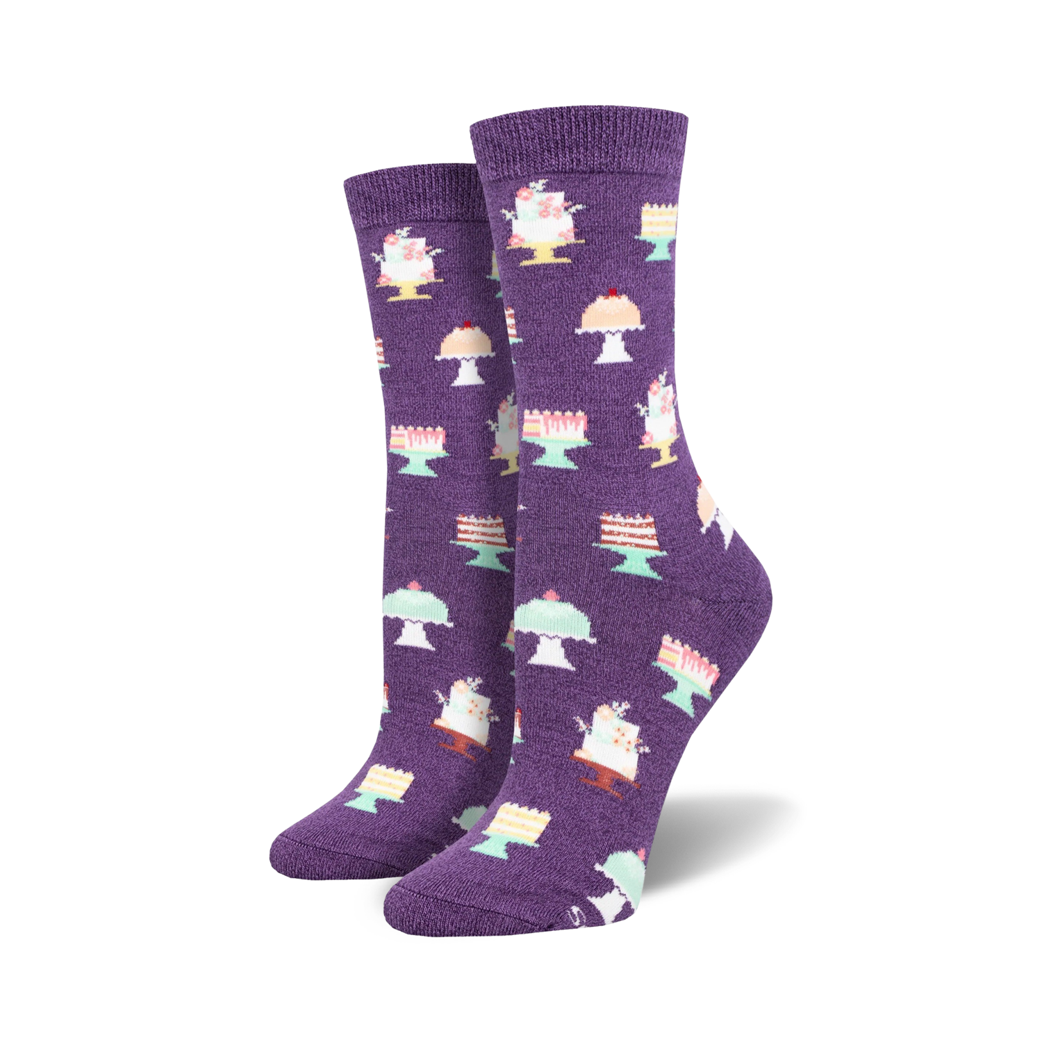 Pair of purple crew socks adorned with a repeating pattern of pastel-colored cakes on stands.