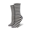 Two dark grey and white striped socks with light grey heels and toes on foot mannequins.