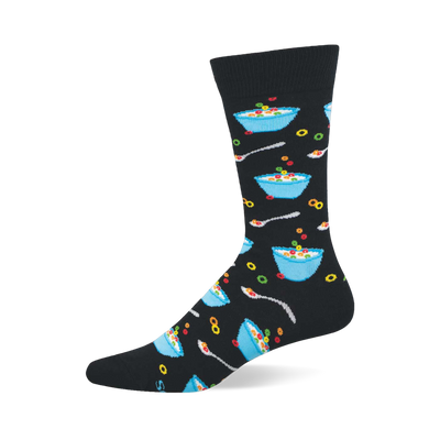 A black crew sock with a repeating pattern of light blue bowls filled with colorful fruity cereal, milk, and silver spoons.