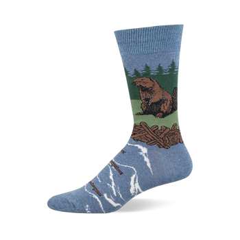 Light blue crew sock with a brown beaver sitting on green land, a brown log dam, green pine trees, and blue water with floating logs.
