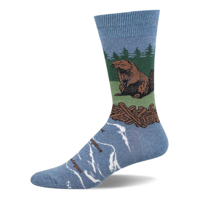 Light blue crew sock with a brown beaver sitting on green land, a brown log dam, green pine trees, and blue water with floating logs.
