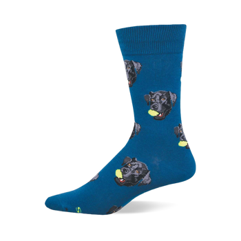One dark blue crew sock with a repeating pattern of black labrador retriever heads, each holding a yellow tennis ball.