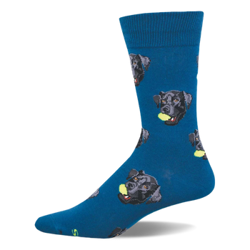 One dark blue crew sock with a repeating pattern of black labrador retriever heads, each holding a yellow tennis ball.