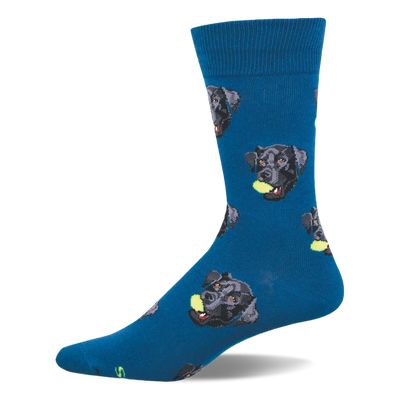 One dark blue crew sock with a repeating pattern of black labrador retriever heads, each holding a yellow tennis ball.