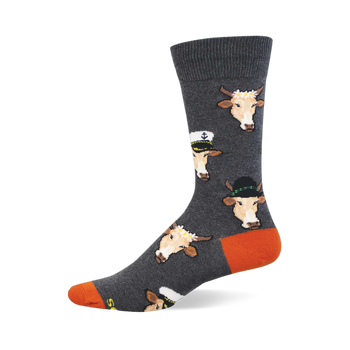 Grey crew socks with repeating pattern of light brown cow faces in sailor hats, fedoras, and flower crowns. Orange heel and toe.