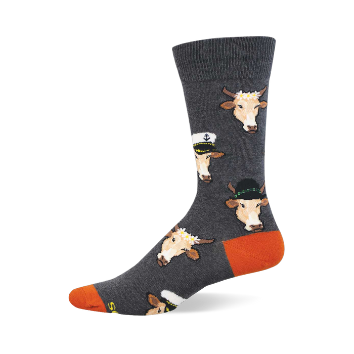 Grey crew socks with repeating pattern of light brown cow faces in sailor hats, fedoras, and flower crowns. Orange heel and toe. }}
