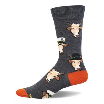 Grey crew socks with repeating pattern of light brown cow faces in sailor hats, fedoras, and flower crowns. Orange heel and toe.