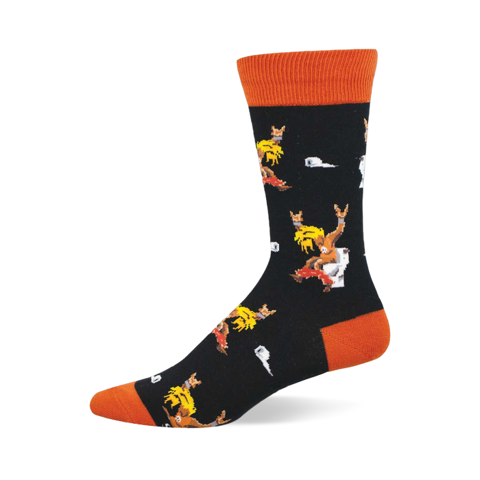 Black crew sock with orange cuff, heel, and toe. Features pixelated blonde-haired figures on toilets with 'rock on' gestures and white toilet paper. }}