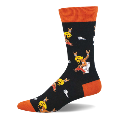 Black crew sock with orange cuff, heel, and toe. Features pixelated blonde-haired figures on toilets with 'rock on' gestures and white toilet paper.
