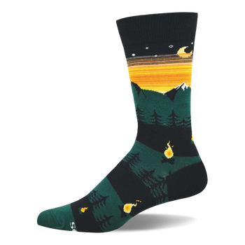 Single crew sock showing dark green mountains, snow caps, orange and yellow striped sky, moon, stars, pine trees, and campfires.